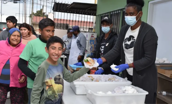 Haitian immigrants in Tijuana receive food from the Casa de los Pobres