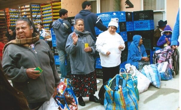 The people come to Casa de los Pobres in Tijuana for beans on Bodega Day