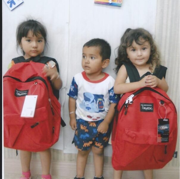 Young children in Tijuana Mexico with school supplies