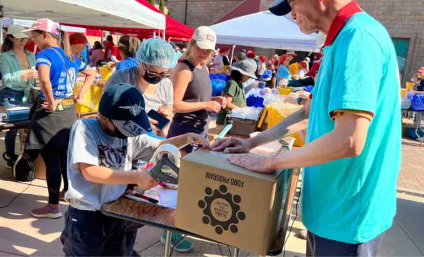 Volunteers packing 2 million meals at Casa de los Pobres USA event in San Diego