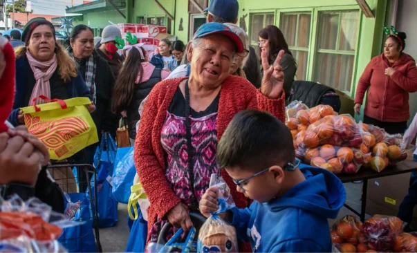 People receive food at Casa de los Pobres Tijuana Mexico.