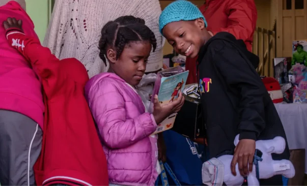 Children receive toys during the Christmas Distribution at Casa de los Pobres in Tijuana Mexico