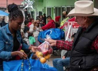 People in Tijuana bring a bag once a week to pick up food.