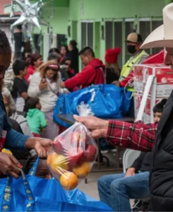 People in Tijuana bring a bag once a week to pick up food.
