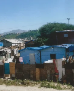 Cardboard shacks with tarps to keep out the rain in Tijuana Mexico