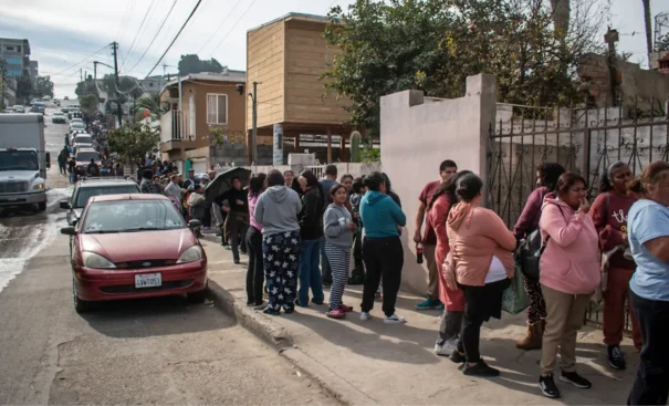 The poor wait for breakfast at the Casa de los Pobres in Tijuana Mexico